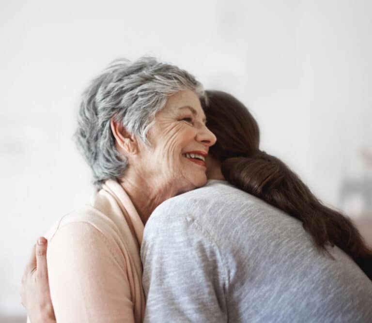Health visitor and a senior woman during home visit.